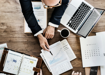 Top view of business data analysis on desk